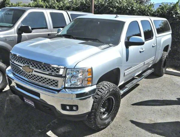4X Series 4-Inch Oval Side Step Bars; Body Mount; Stainless Steel (07-14 Silverado 2500 HD Crew Cab)