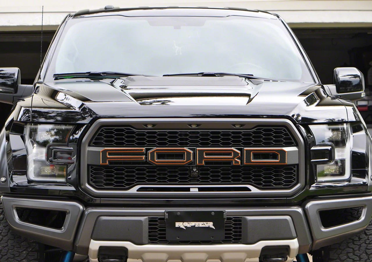 Front Grille Letter Overlays; Domed Carbon Fiber with Orange Outline (17-20 F-150 Raptor)